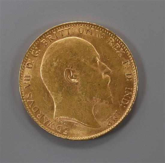 An Edward VII 1910 gold full sovereign.